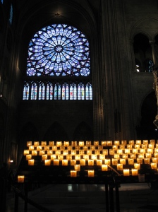 lighting a candle for Joah at Notre Dame