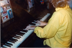 Years later, on a visit home, Mama captured photo-shy me as I played the piano I learned on.